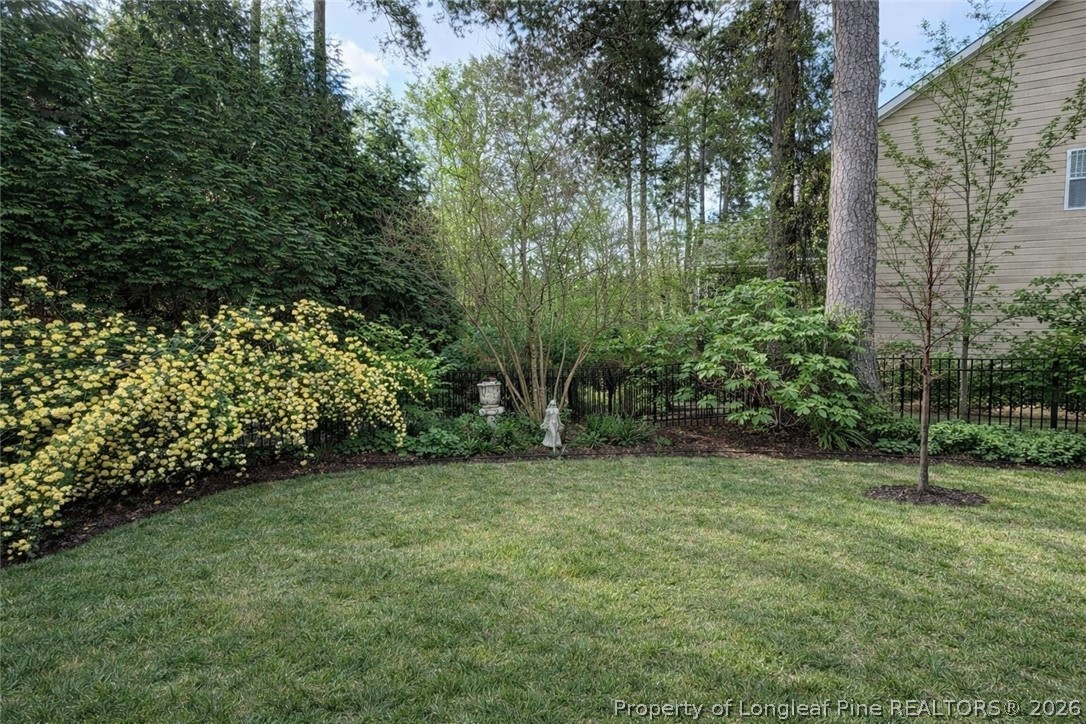 14 Spring Water Court Spring Lake, NC 28390 - Photo 27 of 34 a view of a green field with trees in the background