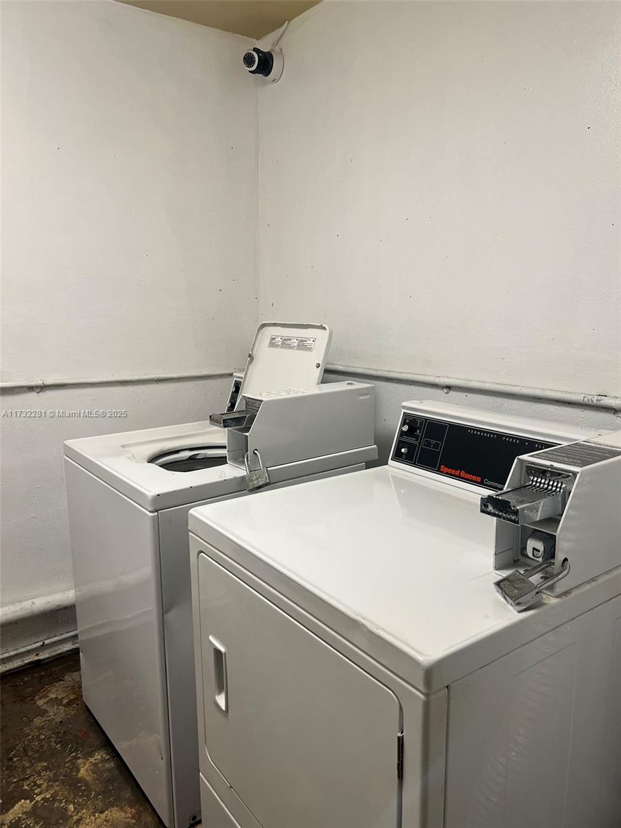 26 Diplomat Parkway, Unit 2332 Hallandale Beach, FL 33009 - Photo 15 of 18 a utility room with dryer and washer