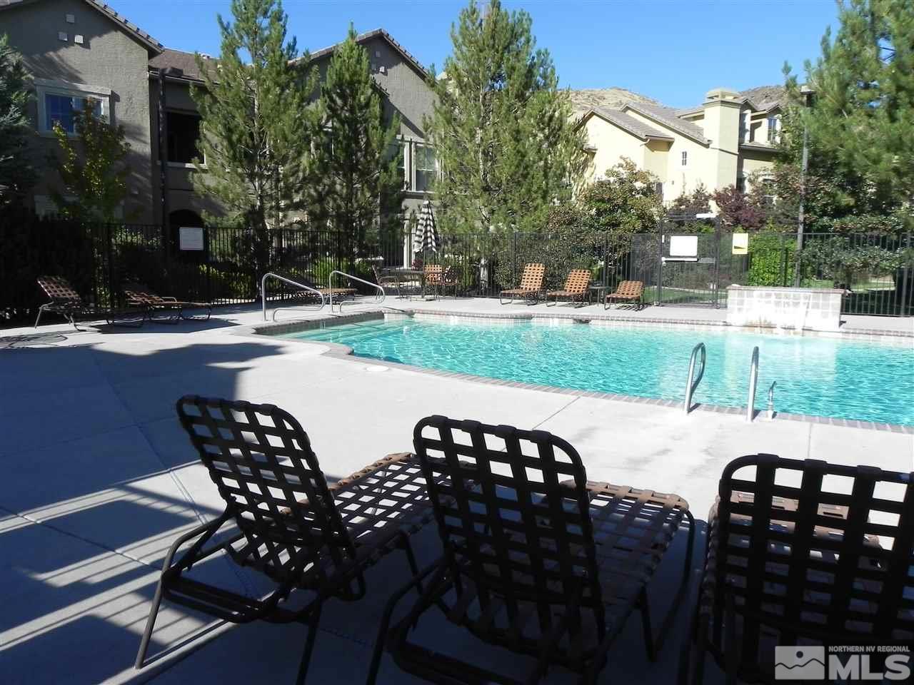9050 Double R Boulevard, Unit 1112 Reno, NV 89521 - Photo 21 of 24 a view of a patio with a yard