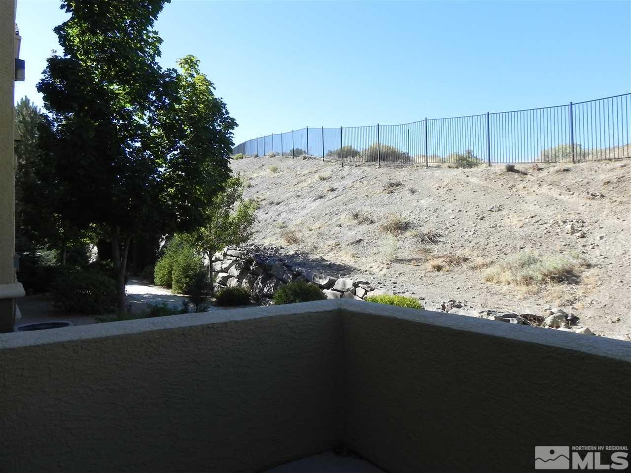 9050 Double R Boulevard, Unit 1112 Reno, NV 89521 - Photo 6 of 24 a view of a backyard of the house