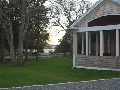 Undisclosed Address Orleans, MA 02653 - Photo 5 of 22 a view of a house with a yard