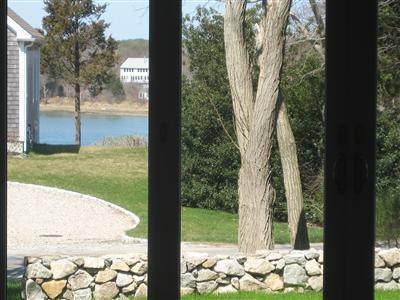 Undisclosed Address Orleans, MA 02653 - Photo 8 of 22 a view of backyard of the house