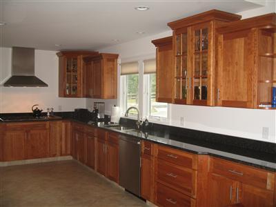 Undisclosed Address Orleans, MA 02653 - Photo 9 of 22 a kitchen with stainless steel appliances granite countertop a sink a stove and a microwave oven