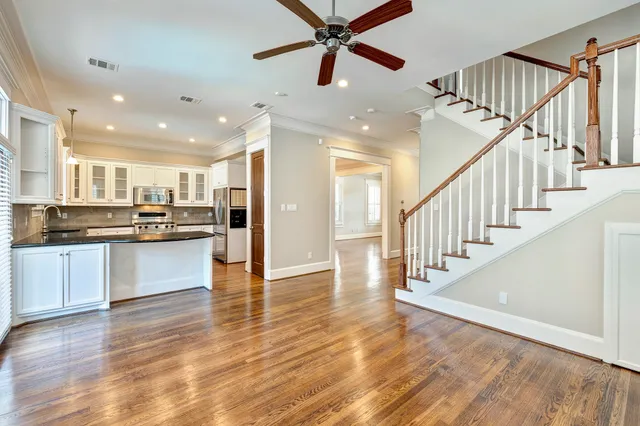 a view of kitchen with cabinets and wooden floor