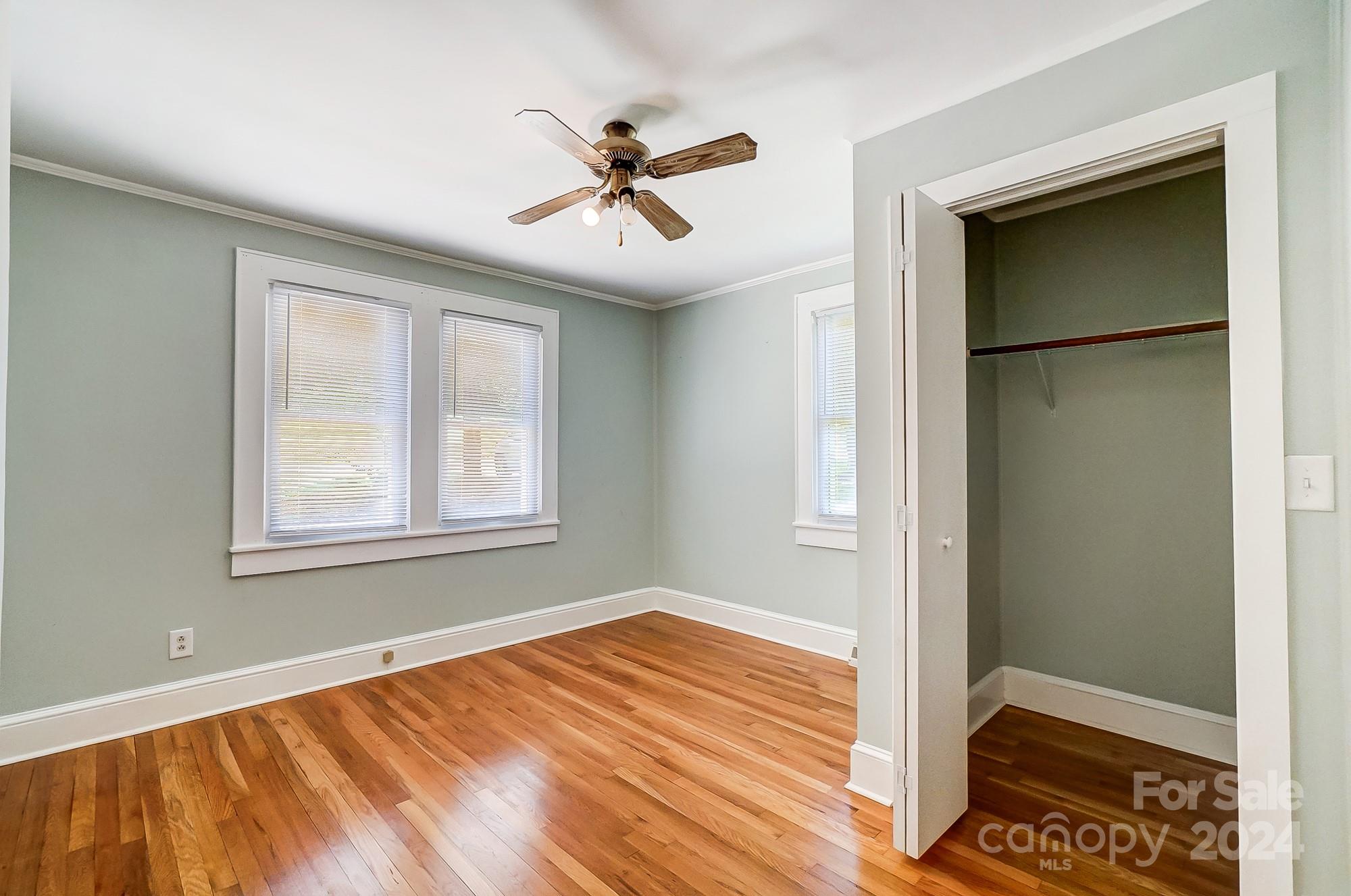 3760 Woodleaf Road Salisbury, NC 28147 - Photo 13 of 31 a view of an empty room with wooden floor and a window