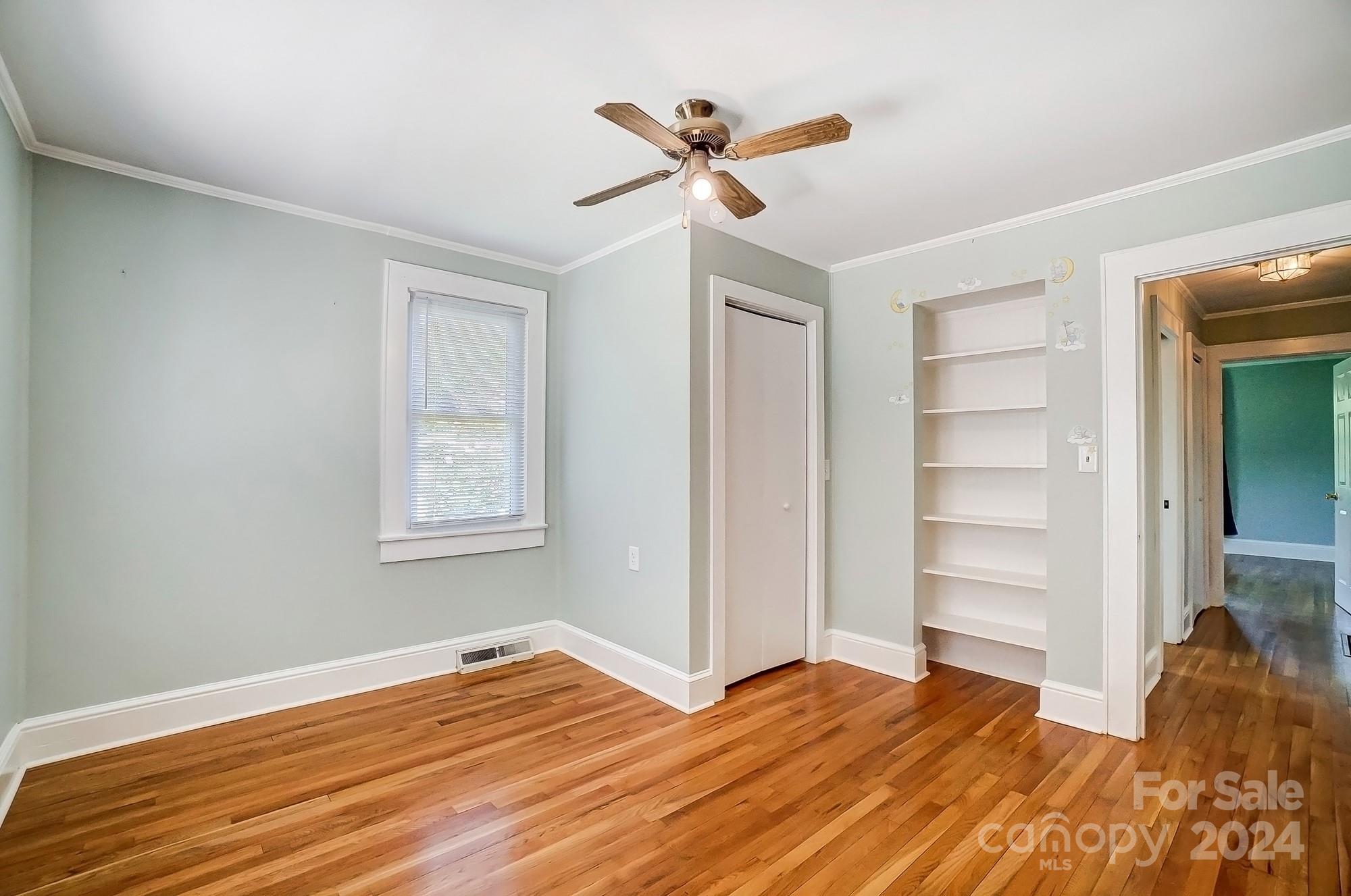 3760 Woodleaf Road Salisbury, NC 28147 - Photo 14 of 31 a view of room with wooden floor and ceiling fan