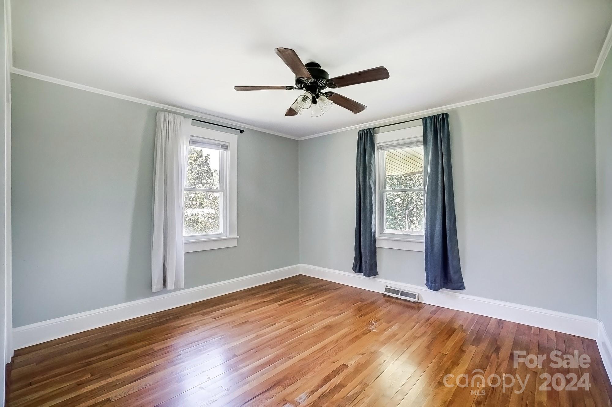 3760 Woodleaf Road Salisbury, NC 28147 - Photo 15 of 31 wooden floor in an empty room with a window