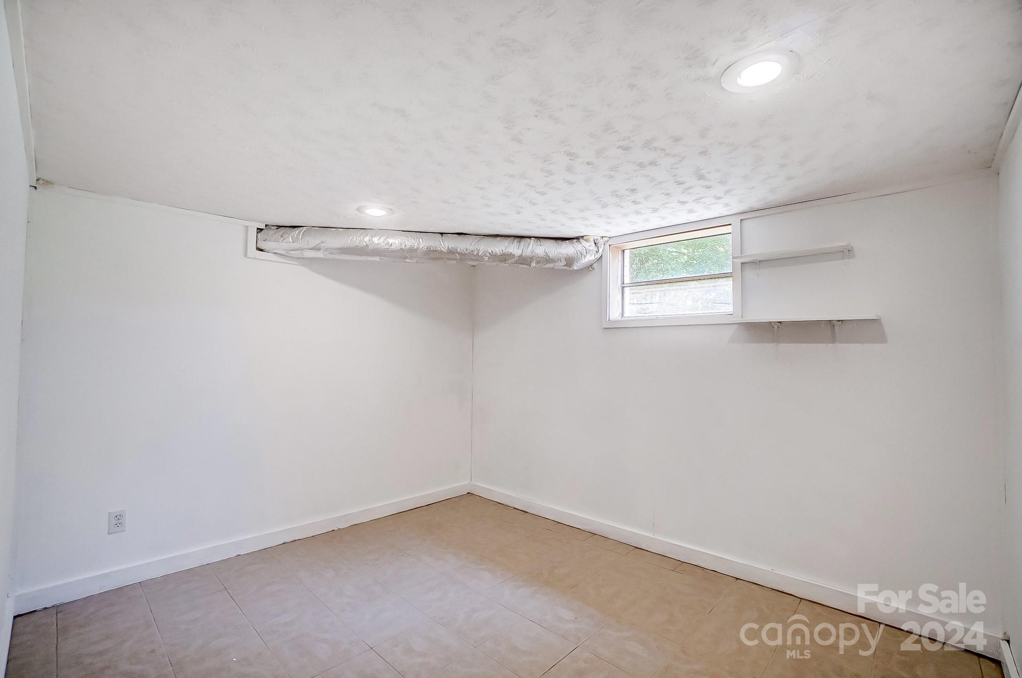 3760 Woodleaf Road Salisbury, NC 28147 - Photo 21 of 31 a view of a room with racks on the wall