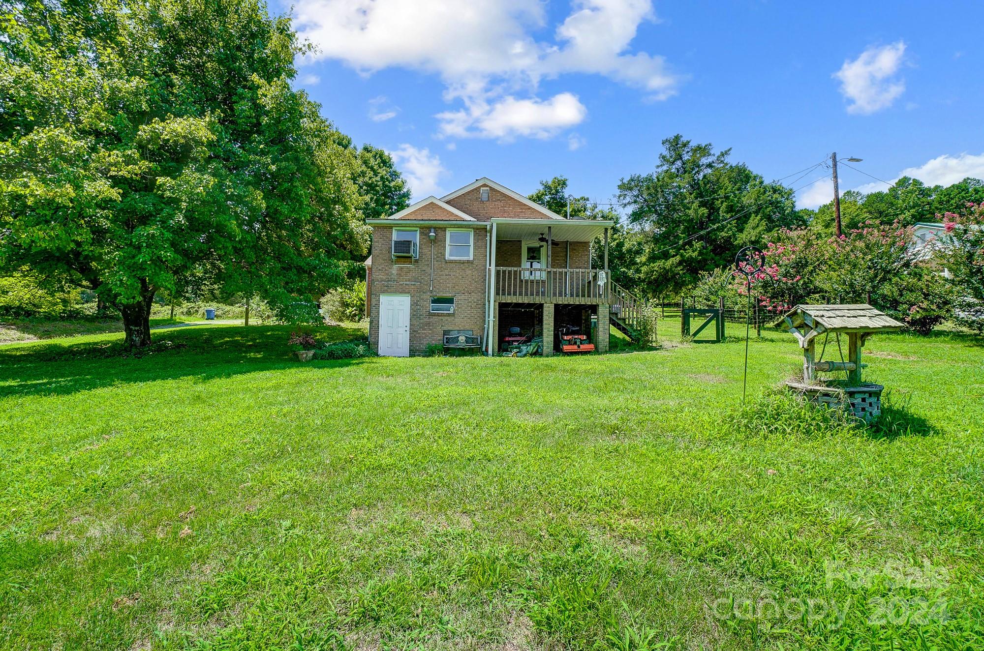 3760 Woodleaf Road Salisbury, NC 28147 - Photo 26 of 31 a view of a house with a big yard and large trees