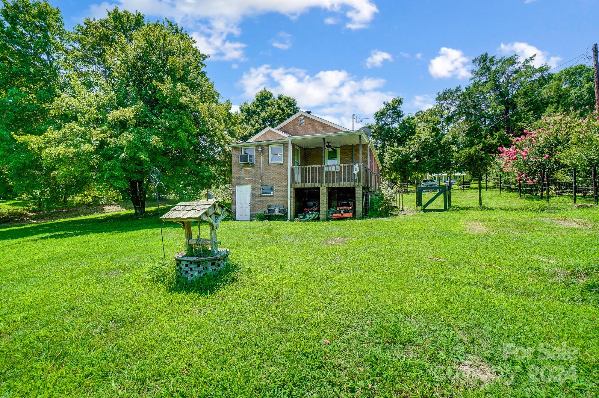 3760 Woodleaf Road Salisbury, NC 28147 - Photo 28 of 31 a view of a house with a yard potted plants and large tree