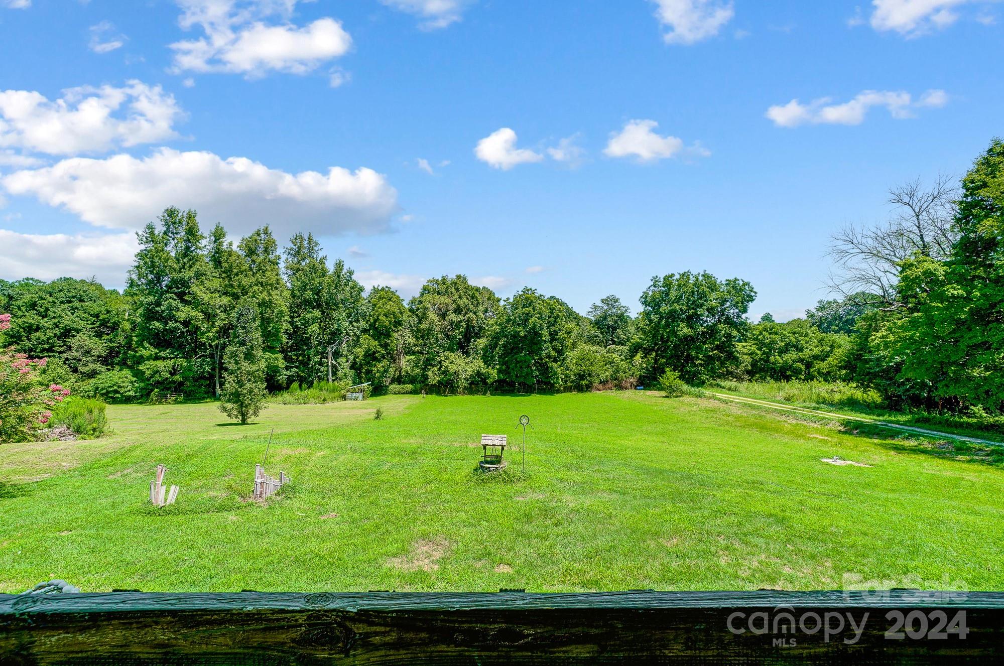 3760 Woodleaf Road Salisbury, NC 28147 - Photo 30 of 31 a view of yard with grass & wooden fence