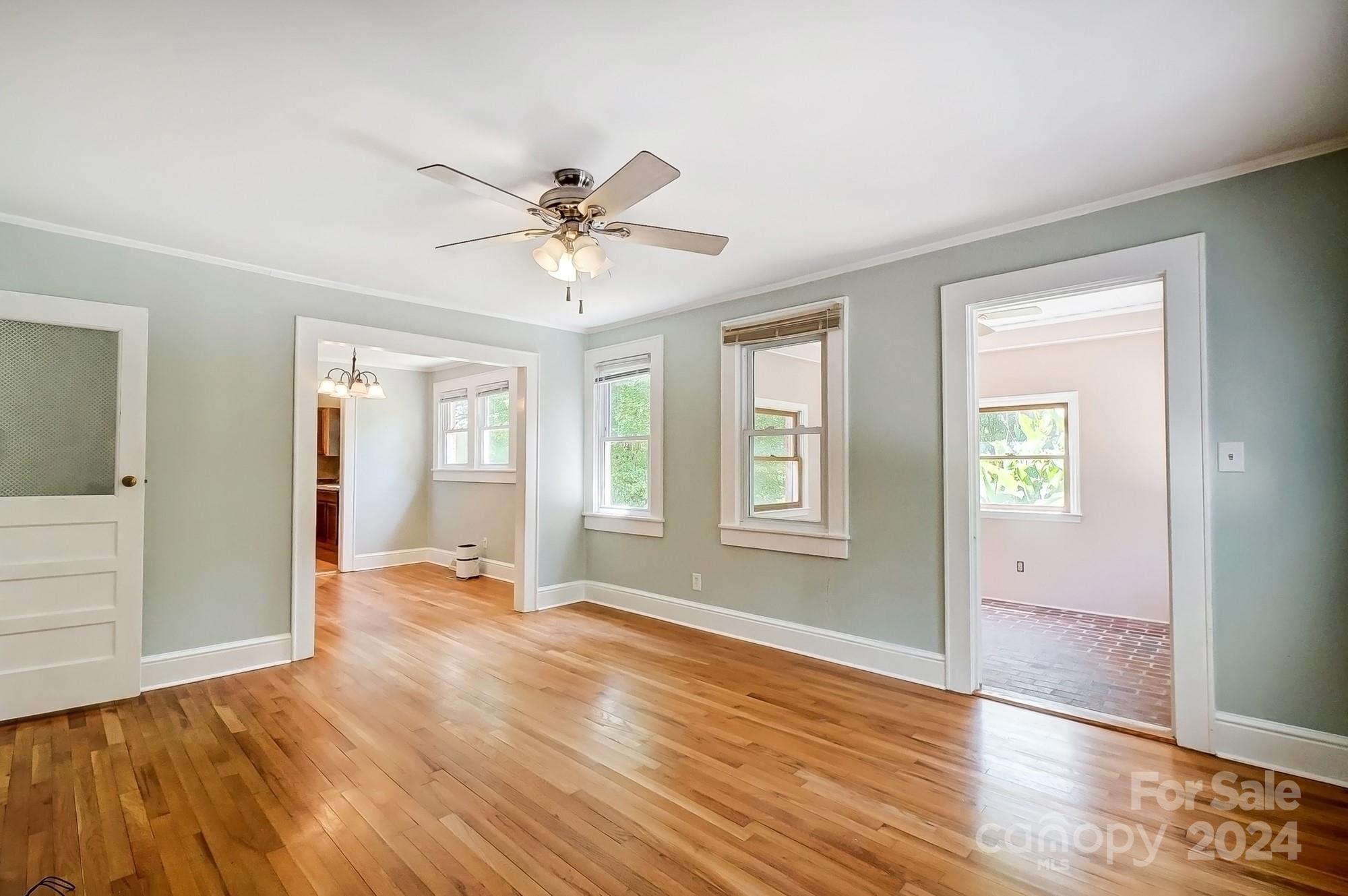 3760 Woodleaf Road Salisbury, NC 28147 - Photo 5 of 31 a view of an empty room with window and wooden floor