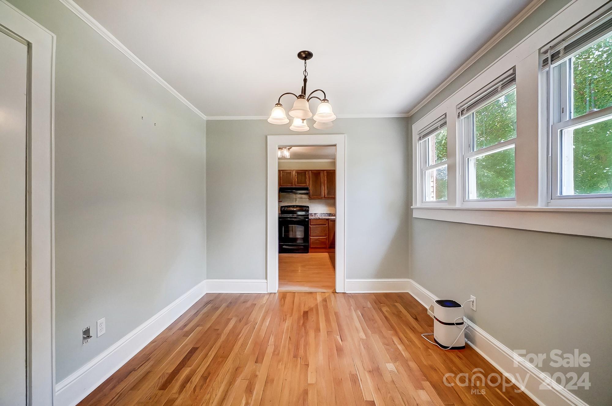 3760 Woodleaf Road Salisbury, NC 28147 - Photo 7 of 31 wooden floor in an empty room with a window