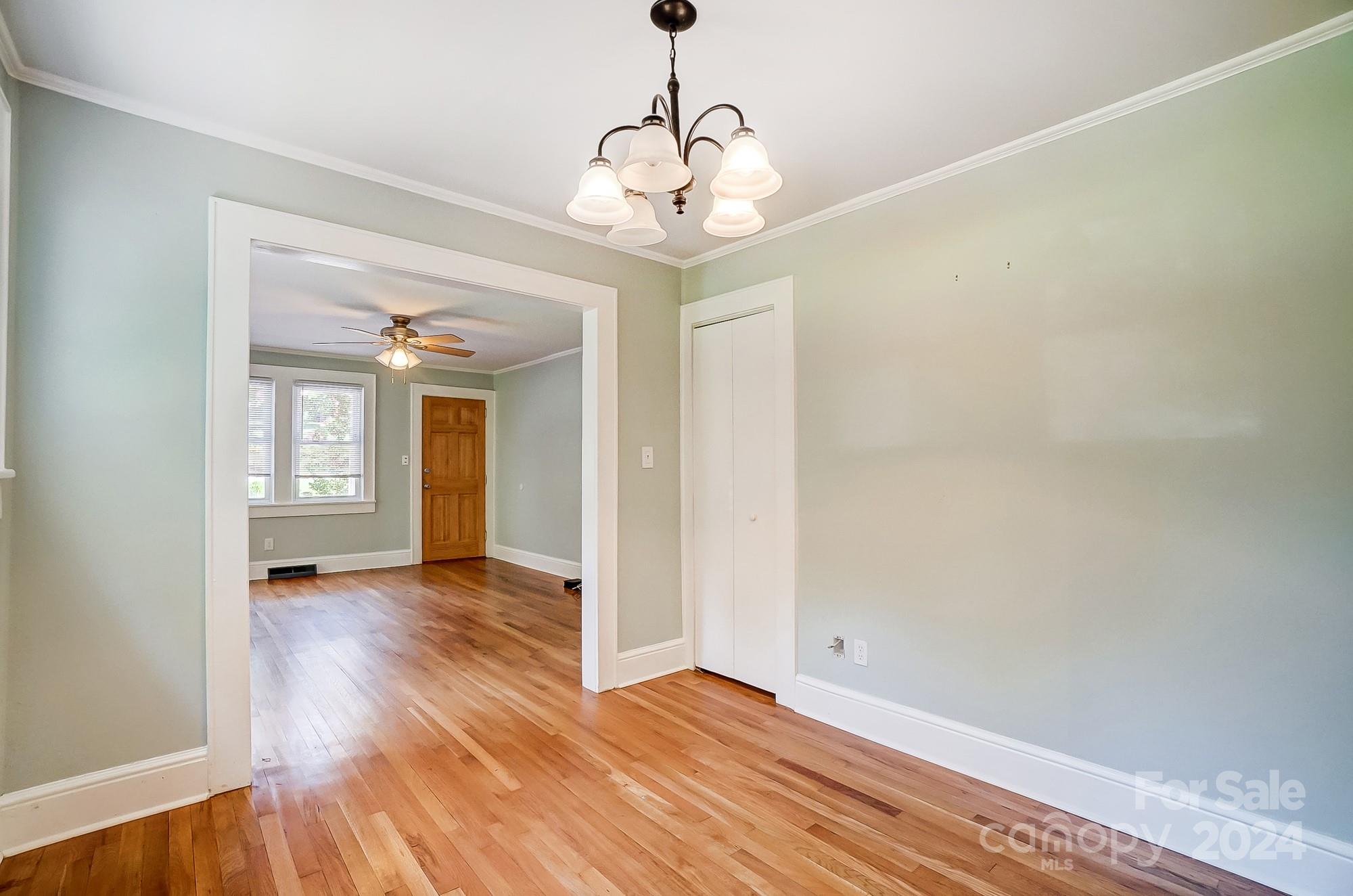 3760 Woodleaf Road Salisbury, NC 28147 - Photo 8 of 31 a view of an empty room with wooden floor and a window