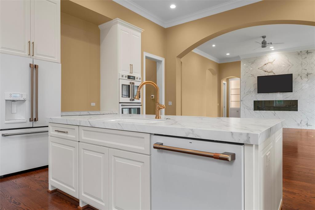 1600 Ridgewood Drive Waco, TX 76710 - Photo 17 of 40 a kitchen with stainless steel appliances granite countertop a sink and a refrigerator