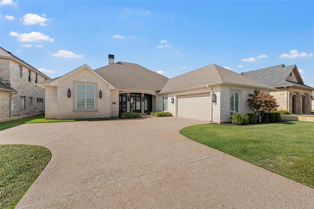 1600 Ridgewood Drive Waco, TX 76710 - Photo 2 of 40 a front view of a house with a yard and garage