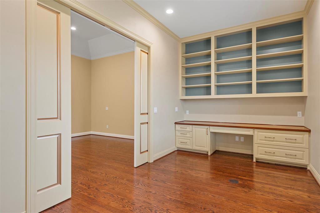 1600 Ridgewood Drive Waco, TX 76710 - Photo 22 of 40 a view of an empty room with a window and wooden floor