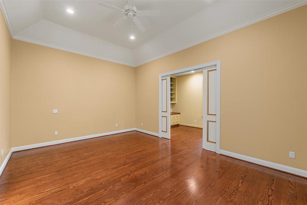 1600 Ridgewood Drive Waco, TX 76710 - Photo 26 of 40 an empty room with wooden floor and windows