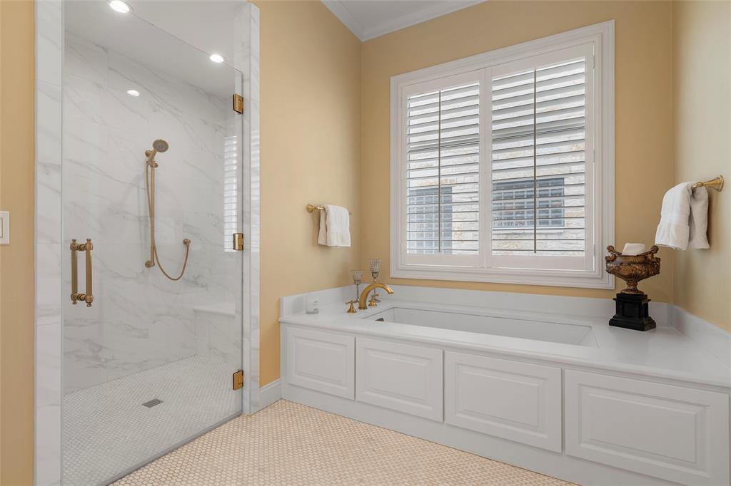 1600 Ridgewood Drive Waco, TX 76710 - Photo 34 of 40 a bathroom with a tub a sink and a window