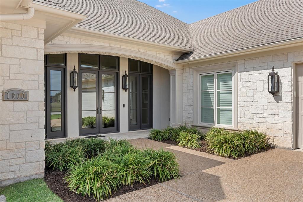 1600 Ridgewood Drive Waco, TX 76710 - Photo 4 of 40 a front view of a house with garden