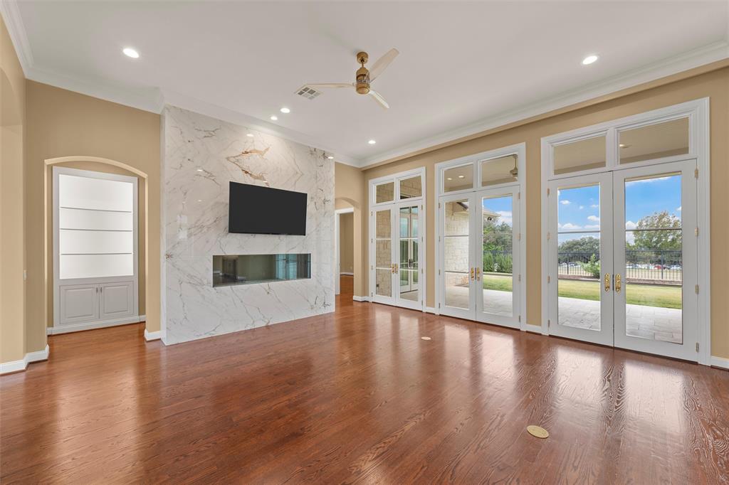 1600 Ridgewood Drive Waco, TX 76710 - Photo 5 of 40 an empty room with wooden floor and windows