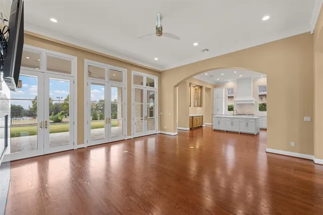 a view of an entryway with wooden floors