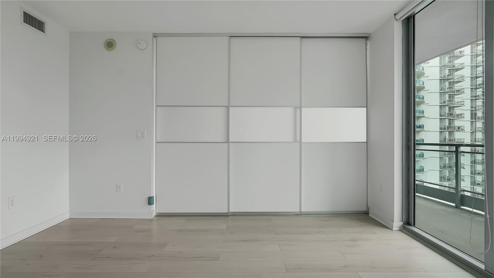 90 Southwest 3rd Street, Unit 3003 Miami, FL 33130 - Photo 28 of 47 a view of an empty room with a window