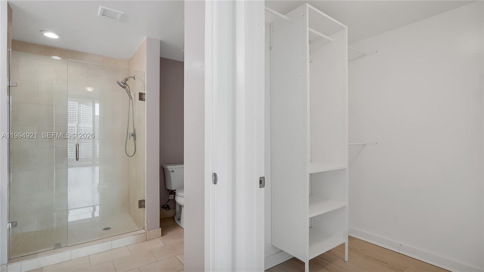 90 Southwest 3rd Street, Unit 3003 Miami, FL 33130 - Photo 31 of 47 a bathroom with a shower and a glass door