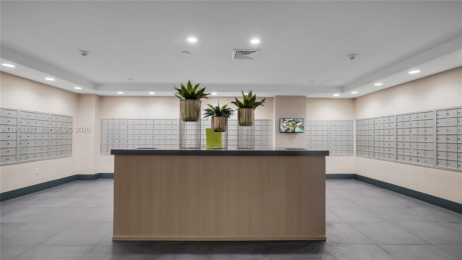 90 Southwest 3rd Street, Unit 3003 Miami, FL 33130 - Photo 42 of 47 a kitchen with stainless steel appliances a sink and a wooden floor