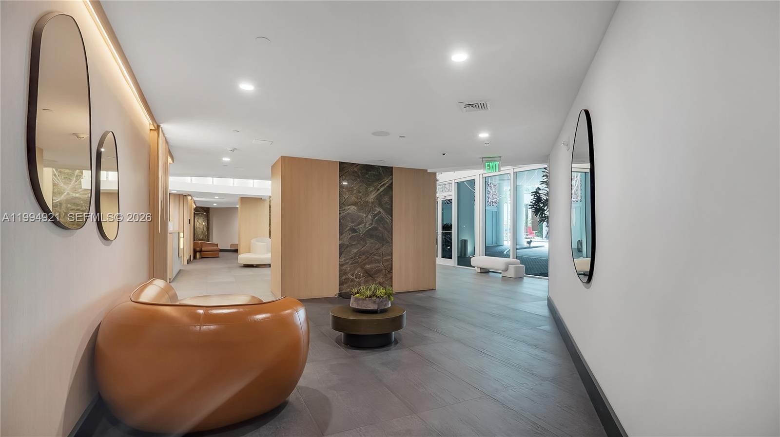 90 Southwest 3rd Street, Unit 3003 Miami, FL 33130 - Photo 44 of 47 a lobby with furniture and a mirror