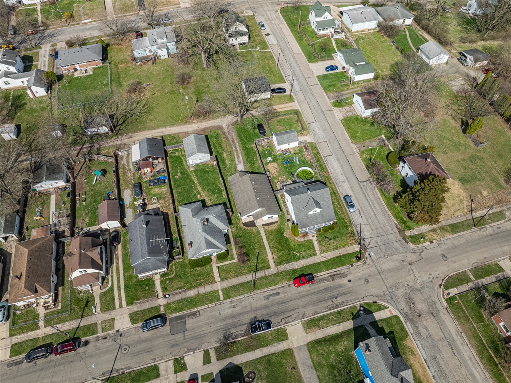 1005 Burt Street Springfield, OH 45505 - Photo 33 of 33 This aerial perspective showcases a vibrant neighborhood with well-maintained homes and lush green lawns.