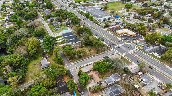 an aerial view of a house with a yard and garden