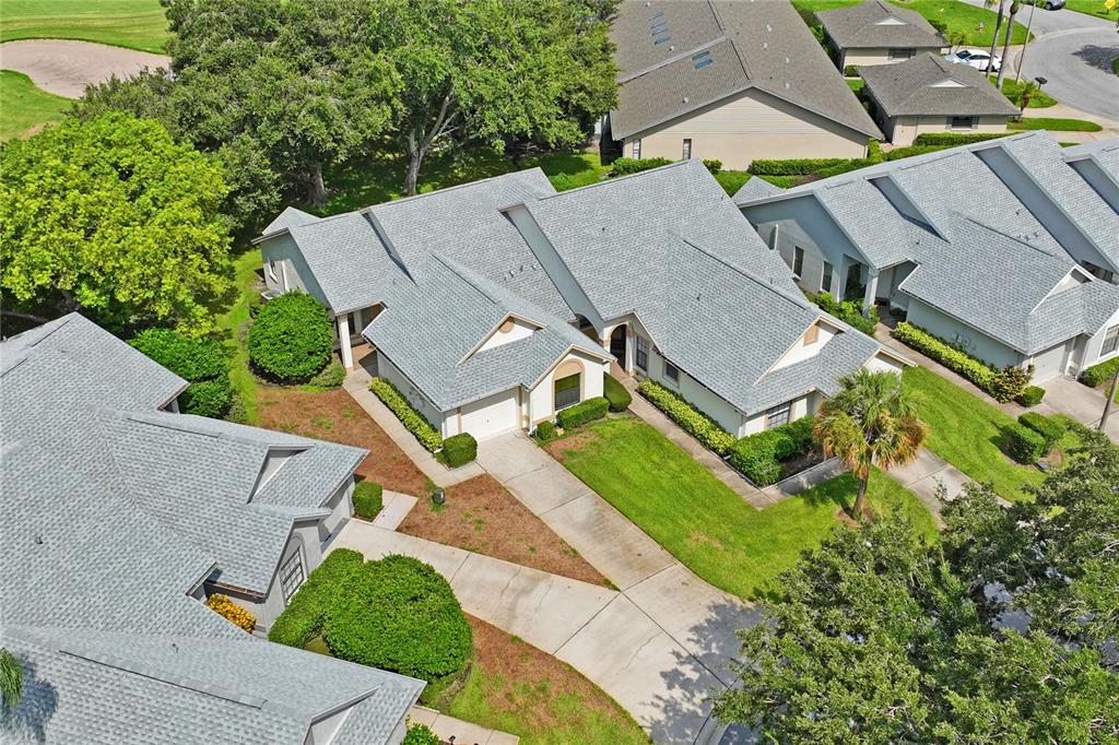 9108 Bassett Lane, Unit B New Port Richey, FL 34655 - Photo 54 of 66 an aerial view of a house with a garden