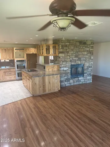 a room with fireplace and wooden floor