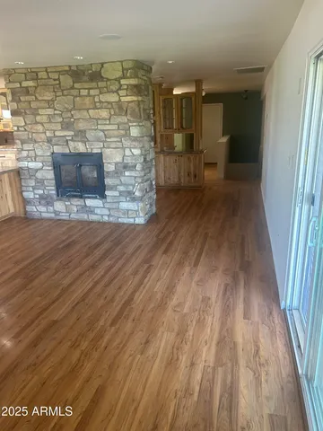 a view of a living room with a wooden floor