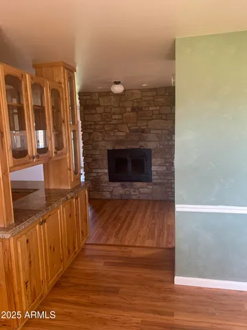 a view of a living room with a wooden floor