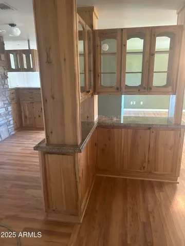 a view of an entryway with wooden floor