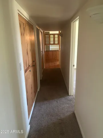 an empty room with wooden floor