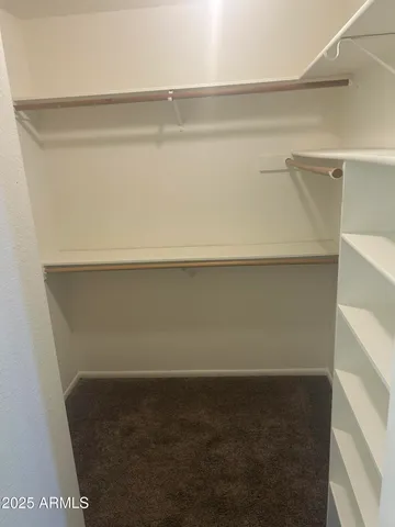 a bathroom with a sink mirror and toilet