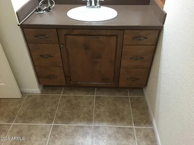 a bathroom with a sink and a toilet