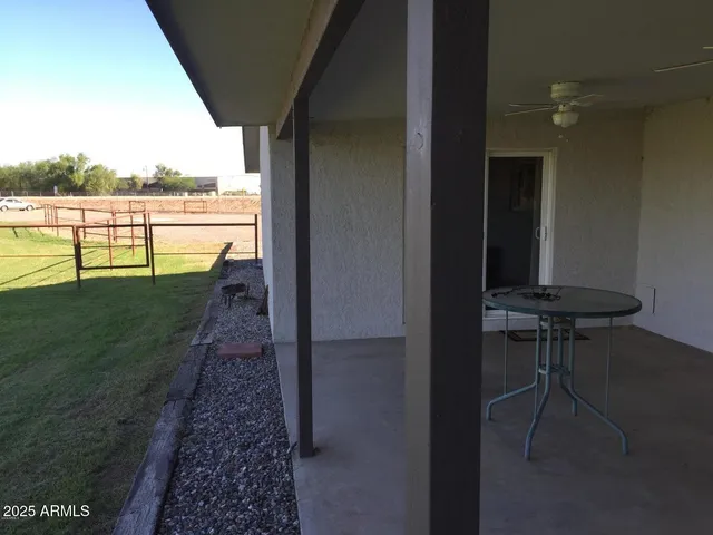 a view of a balcony with wooden floor and outdoor space