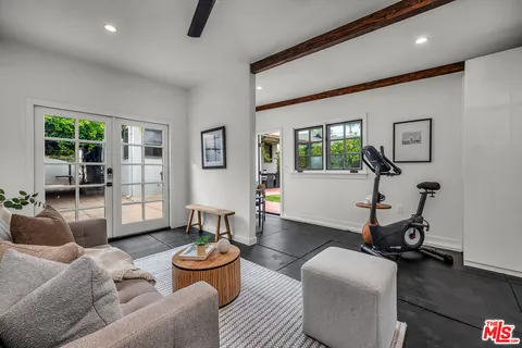 a view of a patio with a table chairs and a backyard