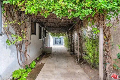 a view of a pathway with a patio