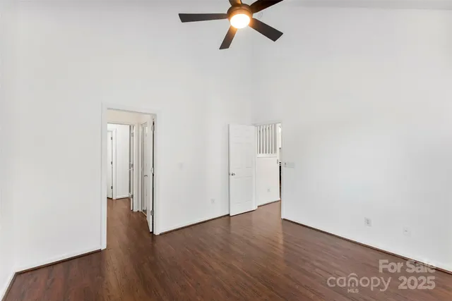 a view of a room with wooden floor
