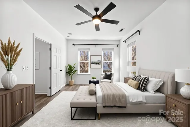 a spacious bedroom with a bed and window