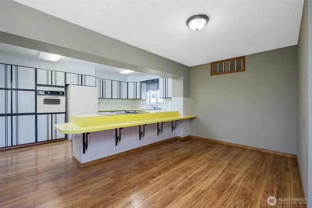 a room with furniture and wooden floor