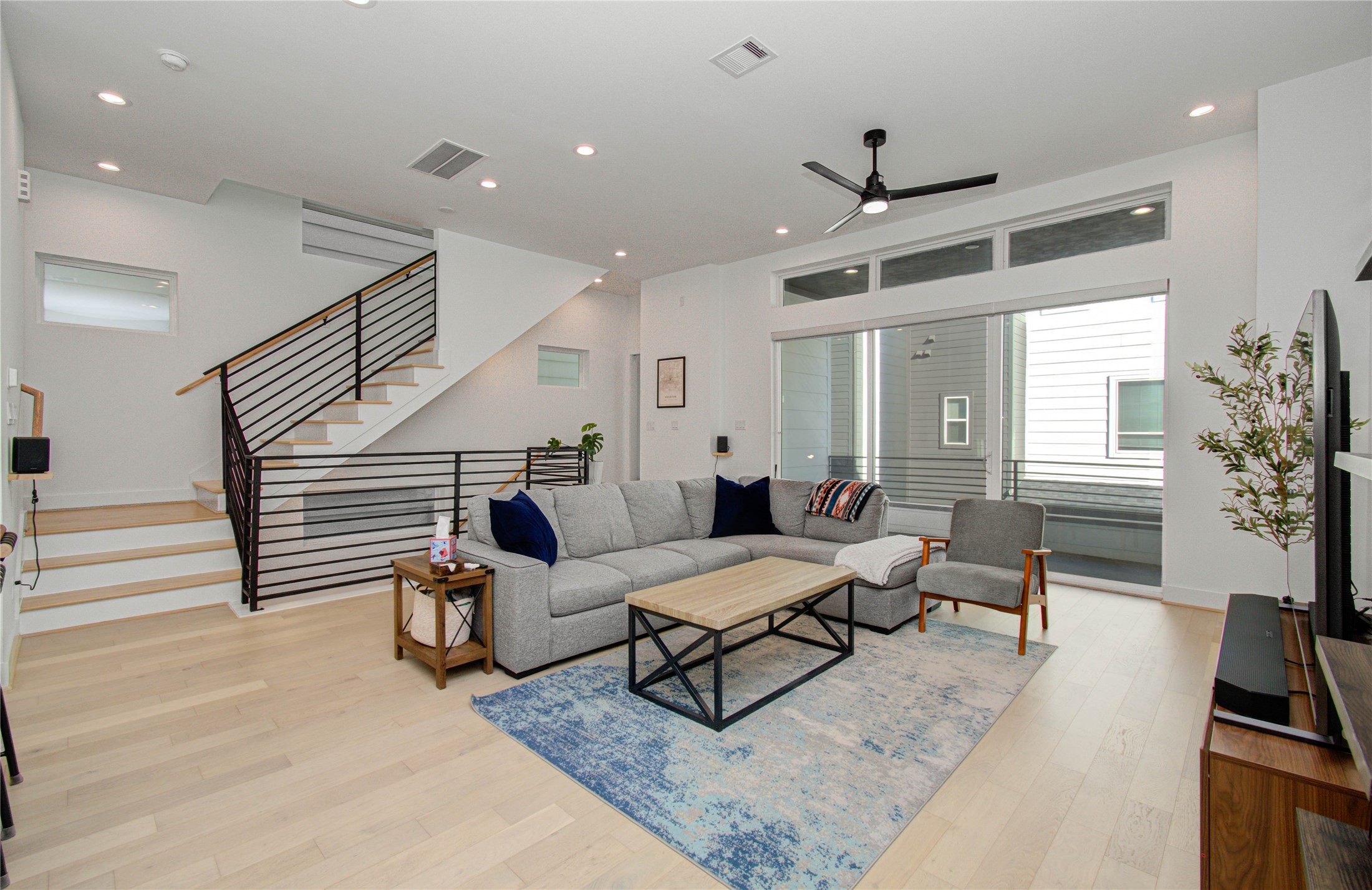 3032 Lamar Street Houston, TX 77003 - Photo 12 of 37 a living room with furniture and wooden floor