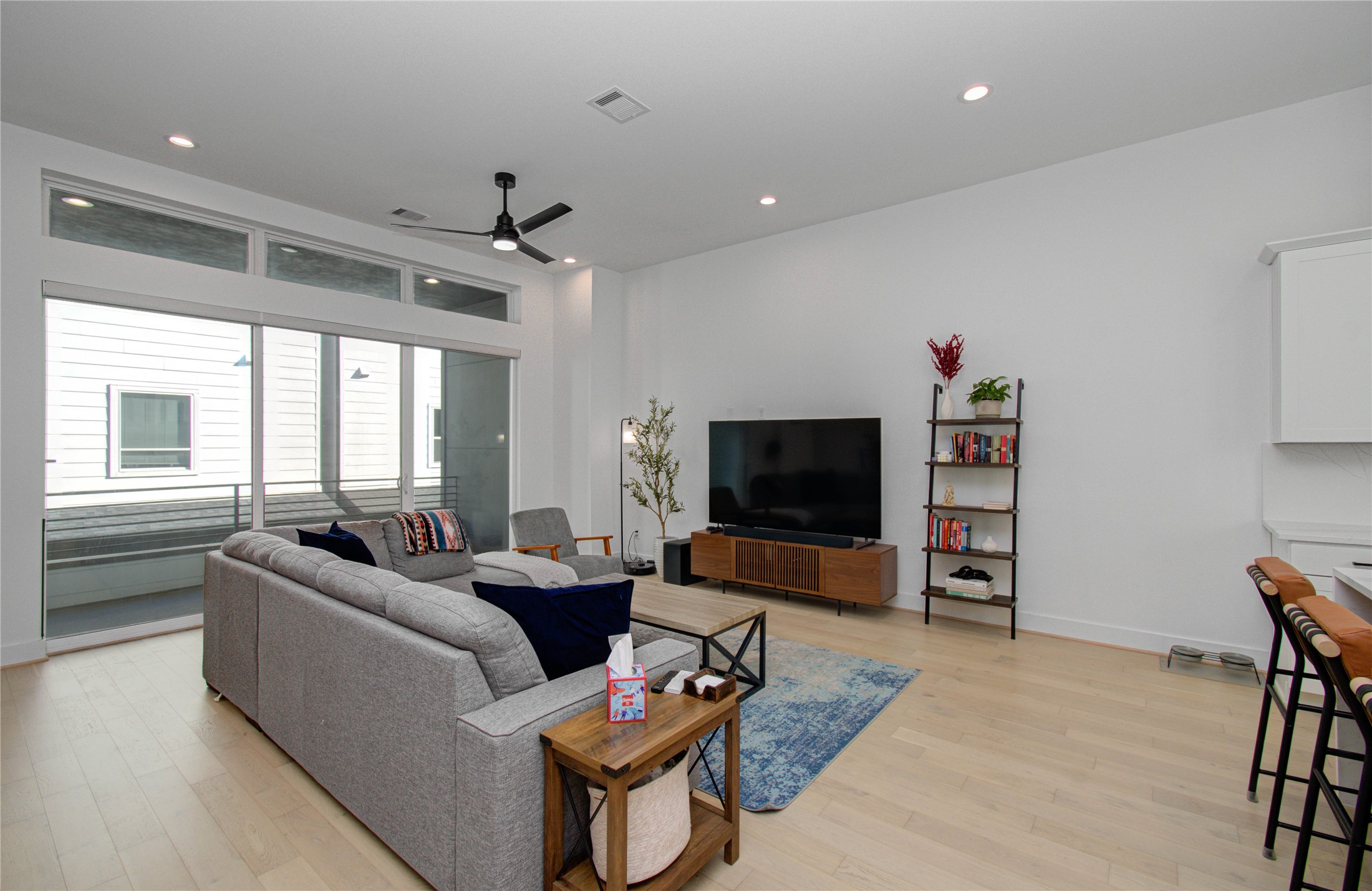 3032 Lamar Street Houston, TX 77003 - Photo 13 of 37 a living room with furniture and a flat screen tv
