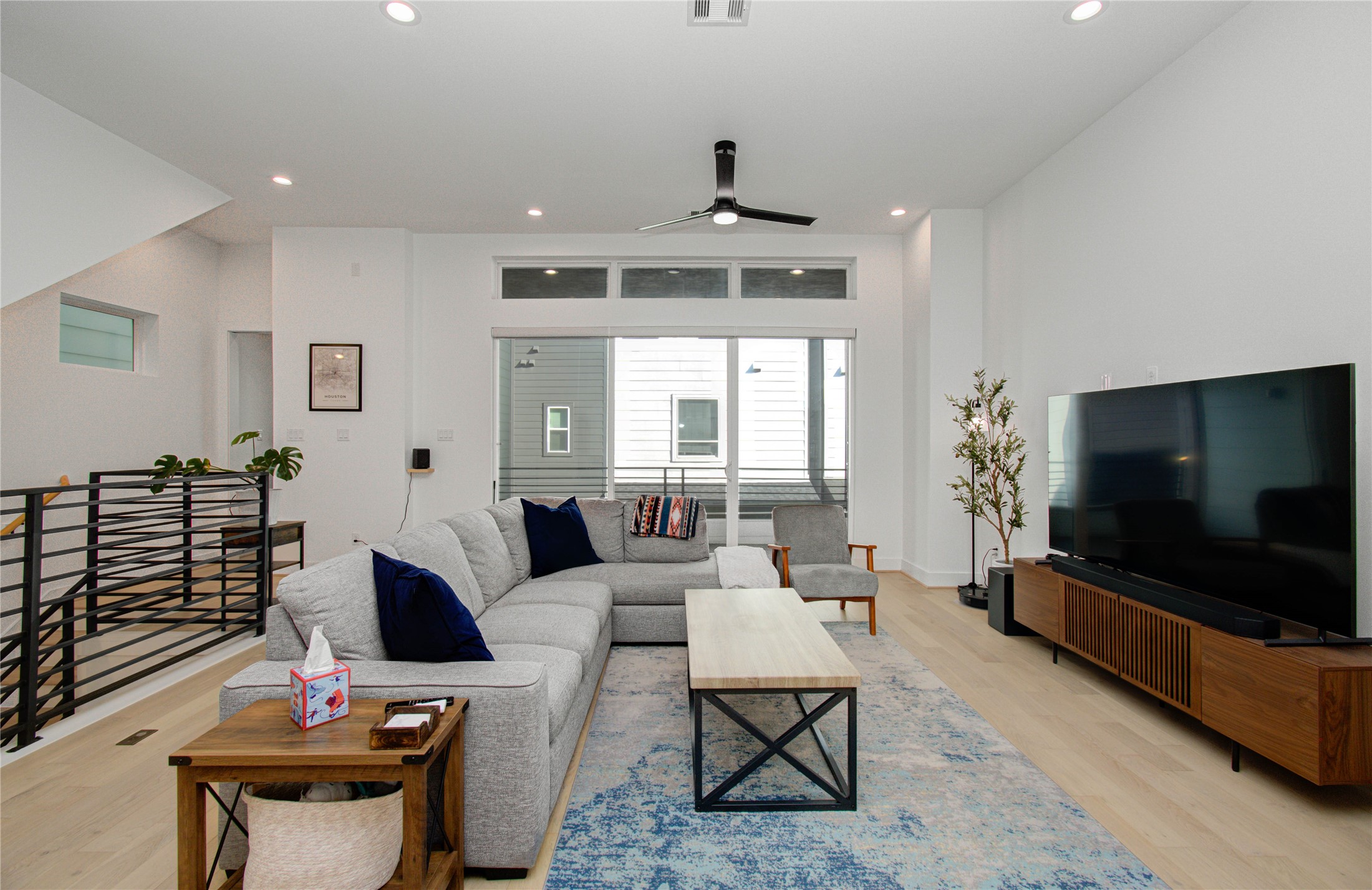 3032 Lamar Street Houston, TX 77003 - Photo 14 of 37 a living room with furniture and a flat screen tv