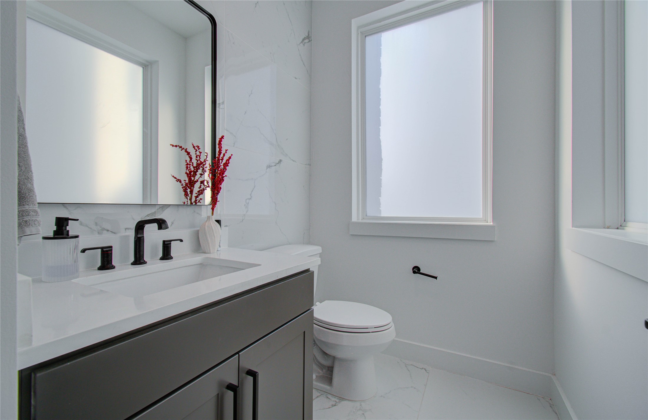 3032 Lamar Street Houston, TX 77003 - Photo 24 of 37 a bathroom with a sink a toilet and mirror